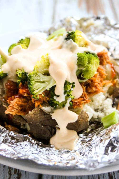 Baked Potatoes with Pulled Pork, Broccoli and cheese sauce.