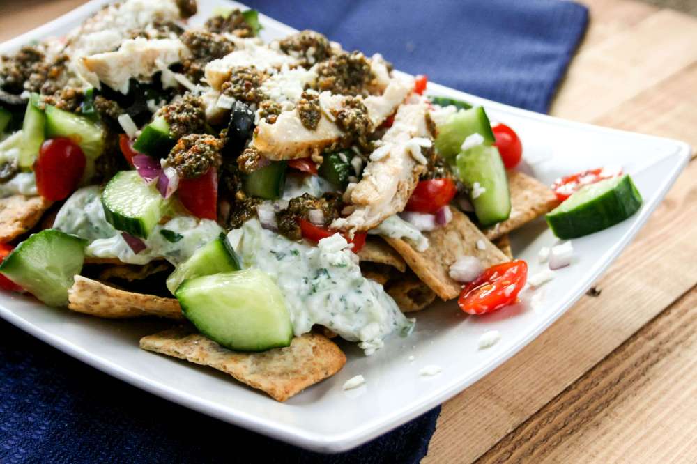 Greek Nachos, with greek salad, grilled chicken, and tzatziki