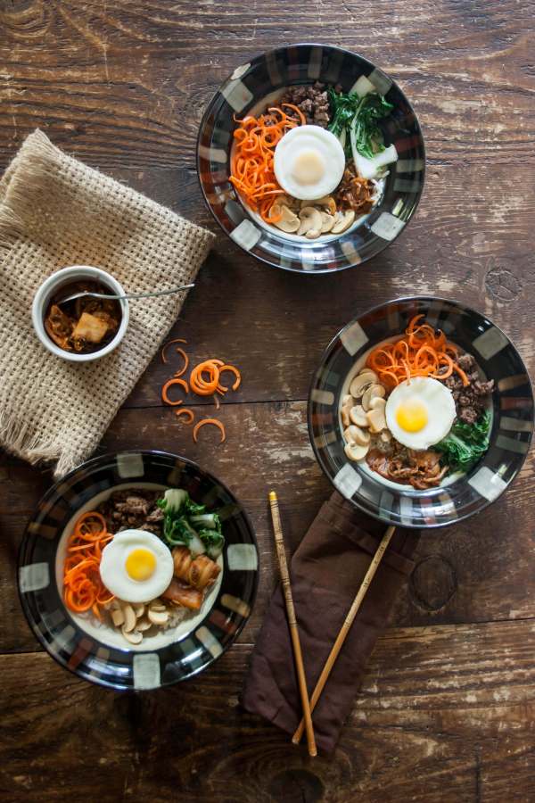 This shortcut version of Korean Bibimbap (a bowl of rice topped with veggies and meat) is quick and easy enough for a weeknight meal.